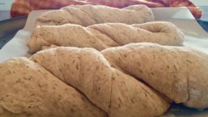 Rising rolls of unbaked bread