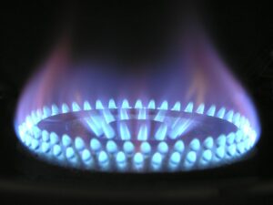 Blue gas ring flames on a black background